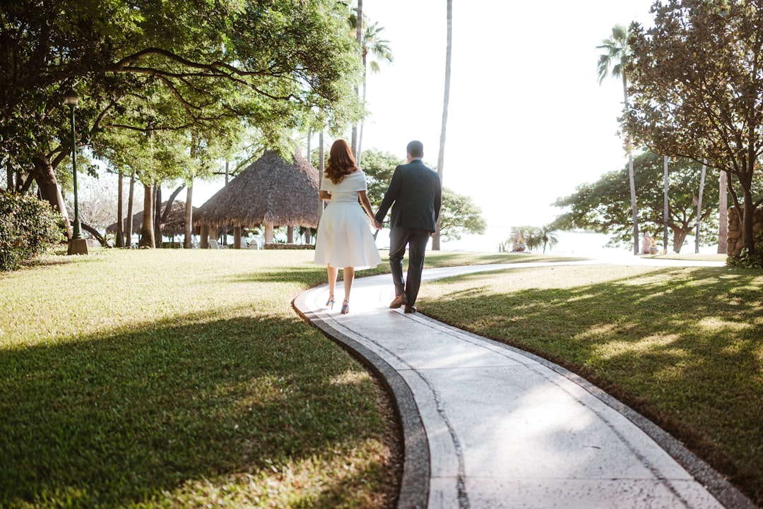 Bride and groom walking outdoors in warm weather
