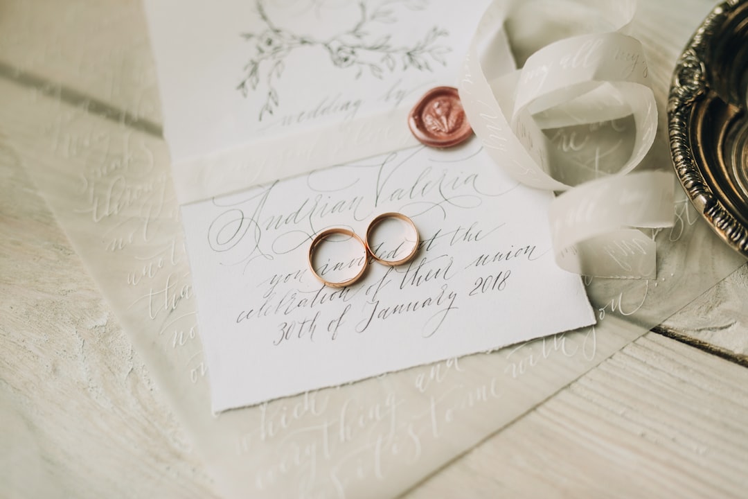 Wedding rings resting on marriage paperwork